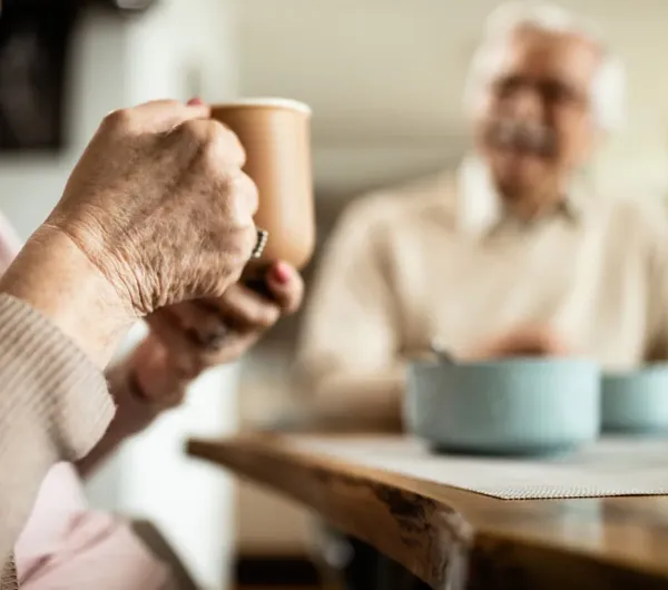 Aged person drinking coffee